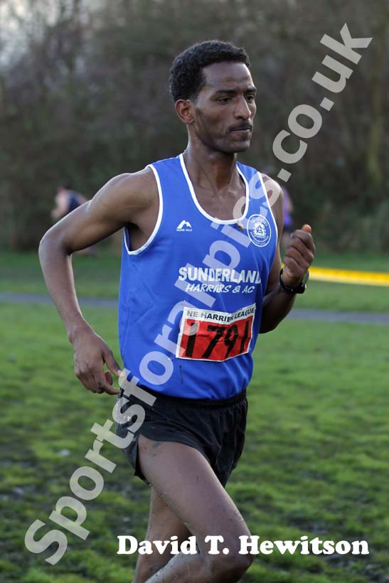 Eritrean athlete Weynay Ghebresilasie running for Sunderland Harriers on his way to third place in the Start First North East Harrier League, Jarrow.
